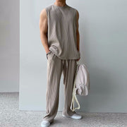 Ensemble sans manches pantalon ample gris taupe — vue portée en pied, sac à la main