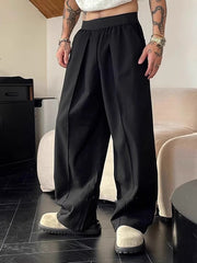 Pantalon ample uni à plis noir — vue portée de face