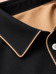 Chemise plastron contrasté noir — gros plan du col, passepoil et bouton blanc