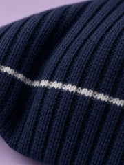 Ensemble bleu marine à col roulé — détail du col. Soniel Paris.