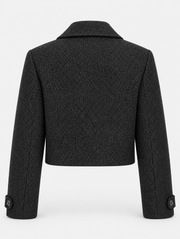 Veste courte noire à larges revers, pièce isolée de dos