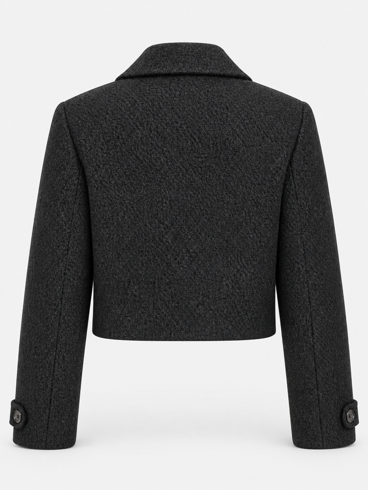 Veste courte noire à larges revers, pièce isolée de dos