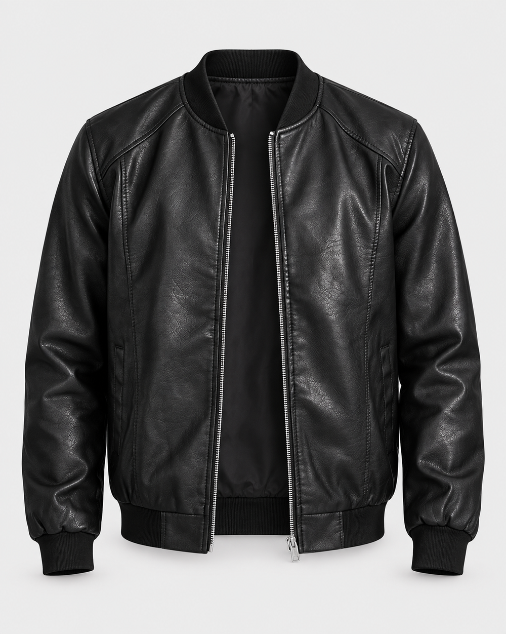 Blouson noir zippé, vue de face sur fond gris clair