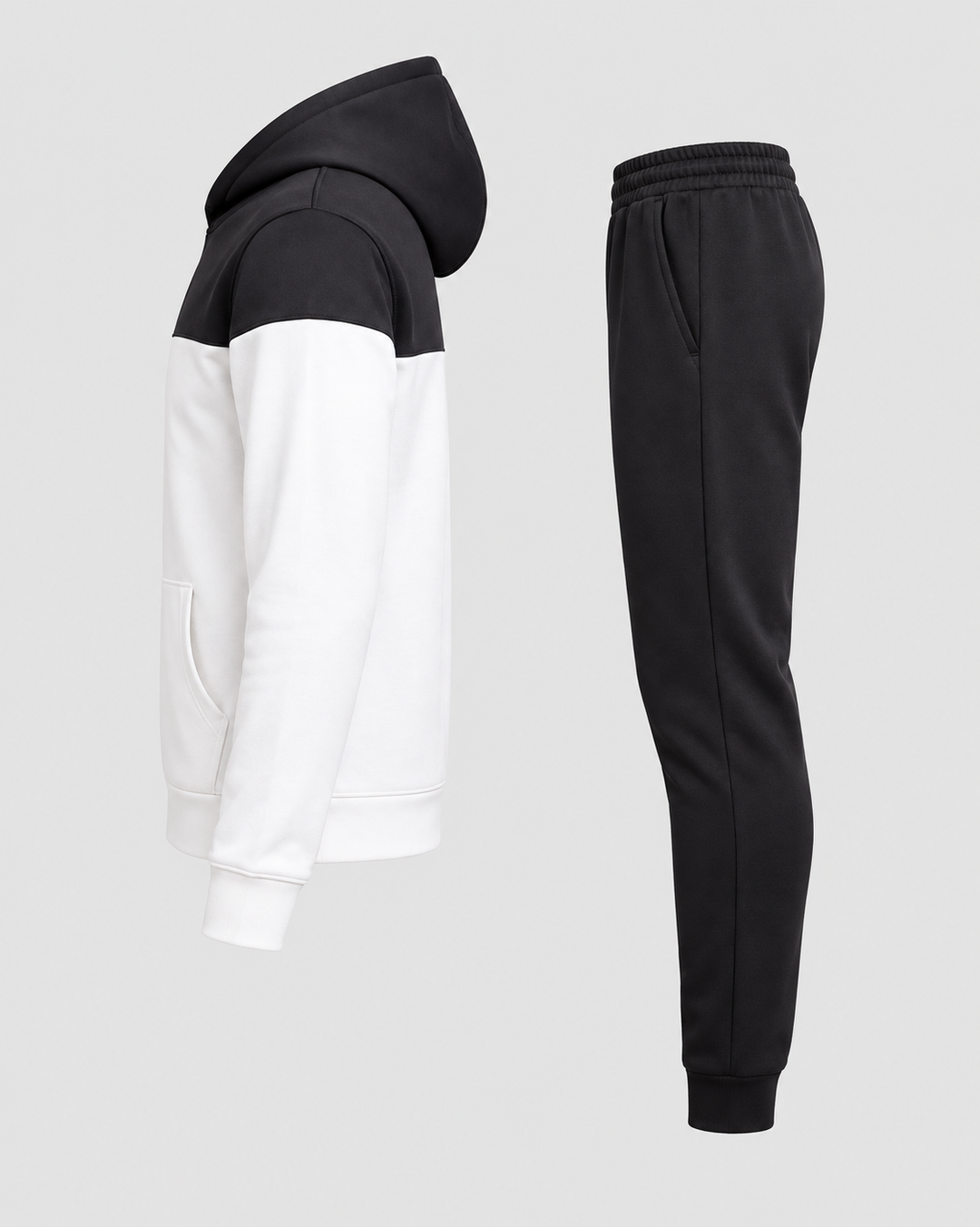 Ensemble sweat blanc et noir et jogging noir, pièces isolées vues de côté