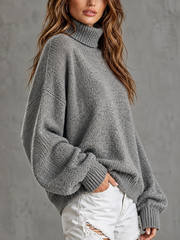 Pull gris à manches lanternes — vue portée de trois-quarts, coupe ample et drapée