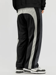 Pantalon ample à panneaux contrastants noir et gris — vue portée de dos