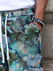 Short à motif floral — gros plan poche latérale et motif