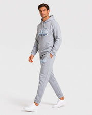 Ensemble sweat et jogging gris clair — vue portée de profil, en marche