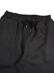 Ensemble deux pièces à motifs graphiques noir — détail du pantalon à cordon
