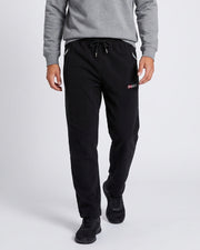 Pantalon jogging cordon poches zippées noir — vue portée de face, avec sweat gris