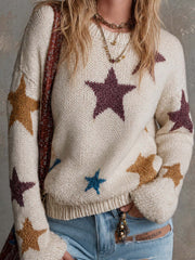 Pull blanc étoiles multicolores — gros plan des étoiles et de la maille duveteuse