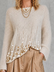 Pull crème à sequins — gros plan de l'ourlet et des sequins dorés en diagonale