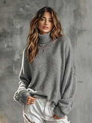 Pull gris à manches lanternes — vue portée en pied, jean blanc déchiré
