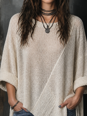 Pull blanc cassé ourlet asymétrique — gros plan de l'encolure en V et de la maille
