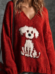 Pull rouge à motif chien — gros plan du chien blanc et de la maille