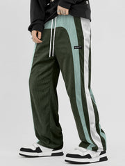 Pantalon ample à panneaux contrastants vert — vue portée de trois-quarts