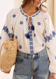 Blouse écrue motifs marine lien col