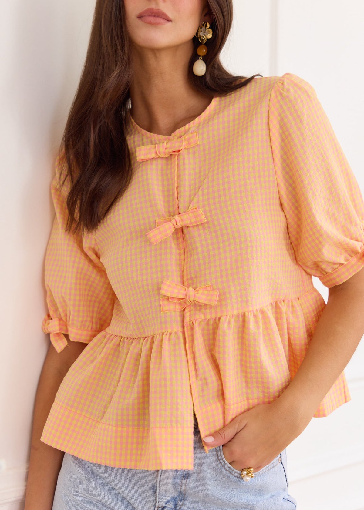 Blouse péplum à carreaux