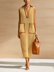 Robe maxi beige à blocs — vue portée en pied, mains devant