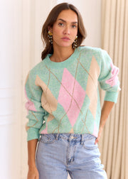 Pull vert rose Hugo — vue portée de face, avec jean