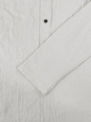 Chemise à capuche blanche, détail de la manche