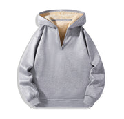 Sweat gris à capuche et zip court, vue de face isolée.