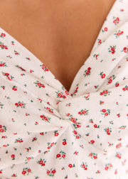 Top fleuri maille pointelle col V