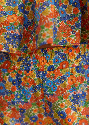 Short fleuri bleu orange volanté