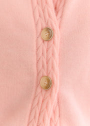 Gilet rose Sophie — gros plan des boutons dorés et de la maille