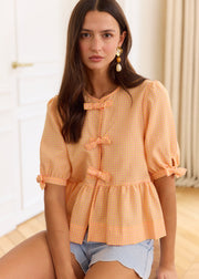 Blouse péplum à carreaux