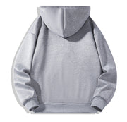 Dos du sweat gris à capuche et zip court.