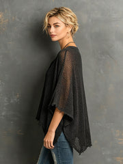 Pull ample à manches chauve-souris noir — vue portée de profil, ourlet asymétrique