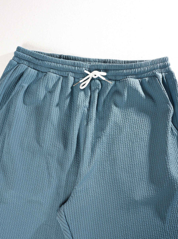 Ensemble côtelé deux pièces bleu gris — détail du pantalon à cordon