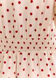 Robe crème à pois rouges