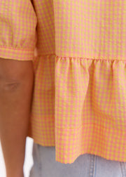 Blouse péplum à carreaux