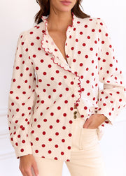 Chemise beige à pois rouges