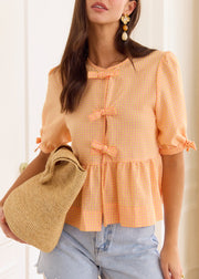 Blouse péplum à carreaux