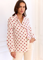 Chemise beige à pois rouges