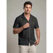Chemise ajustée à nouer devant — noire en maille ajourée, motif visible de face
