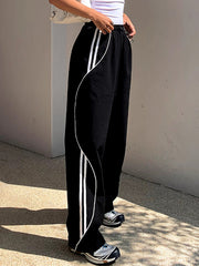 Pantalon de jogging à bandes noir, vue portée, détail des jambes