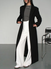 Manteau noir long à revers
