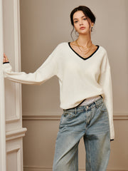 Top tricot brodé épaule drapée