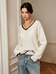 Top tricot brodé épaule drapée