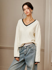 Top tricot brodé épaule drapée