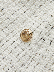 Jupe mini plissée tweed boutons métal