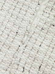 Jupe mini plissée tweed boutons métal