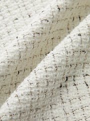 Jupe mini plissée tweed boutons métal