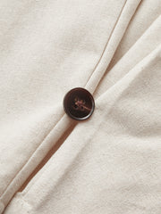 Pantalon ballon à panneau simili ivoire, détail du bouton