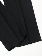 Pantalon ample à boucle métallique noir, détail du bas