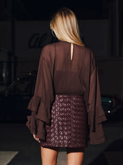 Jupe mini simili cuir tressée